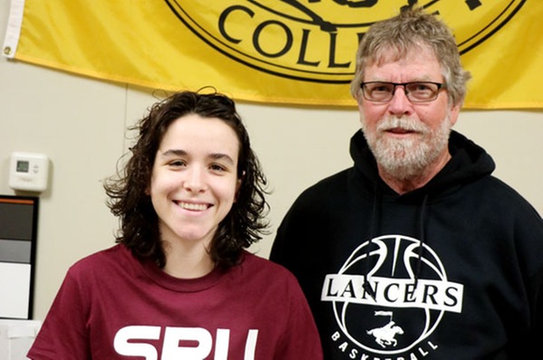 Abril Rexach-Roure with Tom Andersen, EWC?s Head Women?s Basketball Coach as she signs her commitment to Seattle Pacific University.
