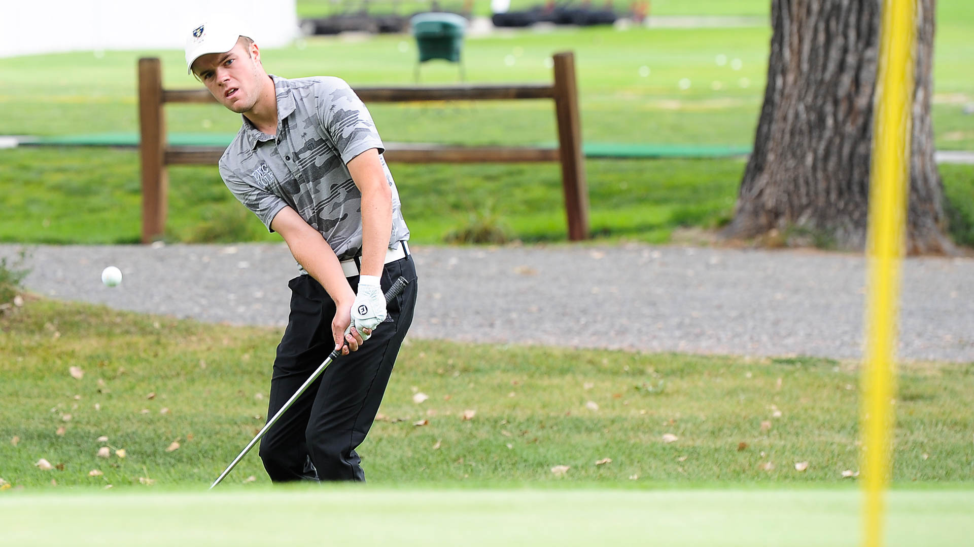 Eastern Wyoming College's Oscar Behle hits the ball onto the green Thursday during the Regional IX Golf Tournament Thursday, Sept. 15 at Cottonwood Golf Course in Torrington, Wyoming. Behle finished in third place with a -2.